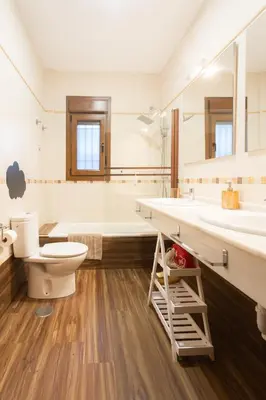 a bathroom with a toilet and a sink and a tub at VILLA DE LUJO CLIMATIZADA. PISCINA Y JARDIN PRIVADO in Chiclana de la Frontera
