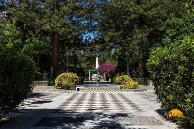 a park with a fountain in the middle of a garden at Travelers Dream by LiveWork in Cádiz