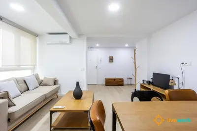 a living room with a couch and a table at Travelers Dream by LiveWork in Cádiz