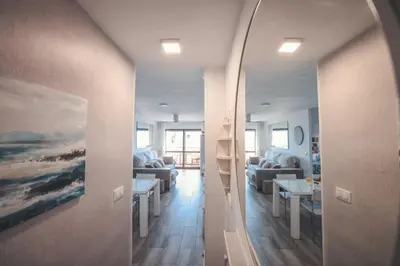a hallway with a view of a living room at Baylight Retreat Apartment in El Puerto de Santa María