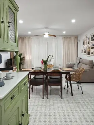 a kitchen and living room with a table and chairs at LA PONDEROSA BEACH in Sanlúcar de Barrameda