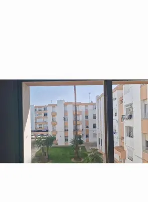 a view of a building from a window at Piso las marismas in Chiclana de la Frontera