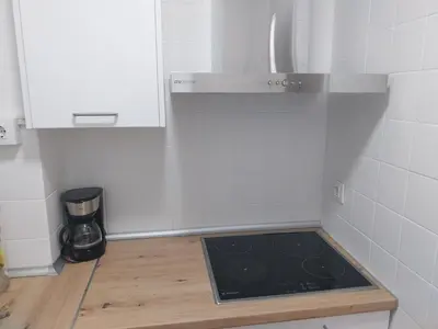 a kitchen with a stove and a counter top at PLAYA LAS PILETAS-CALZADA in Sanlúcar de Barrameda