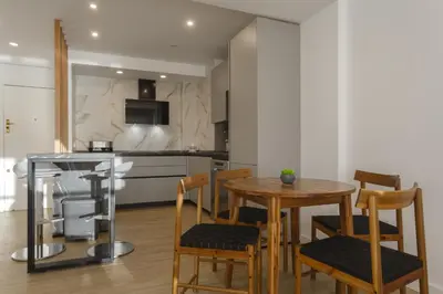 a kitchen and dining room with a table and chairs at DELFIN Sunny Home by Cadiz4Rentals in Cádiz