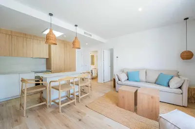 a living room with a couch and a table at Punta Candor Suites in Rota