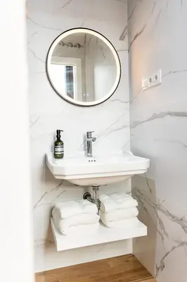 a bathroom with a sink and a mirror at Villa de Paradas in Cádiz