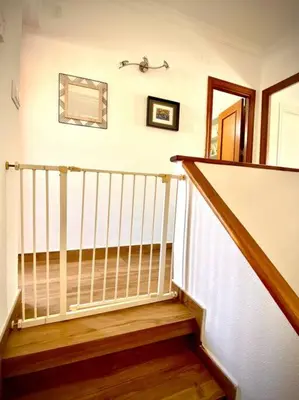 a stairway with a white railing and a stair case at MyChoice Villa Almadraba in Rota