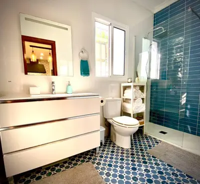 a bathroom with a toilet and a sink and a shower at MyChoice Villa Almadraba in Rota