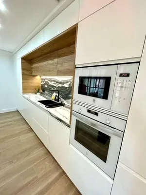 a kitchen with a stove and a microwave at GATU PREMIUM Deseo Piso de Lujo con Parking 