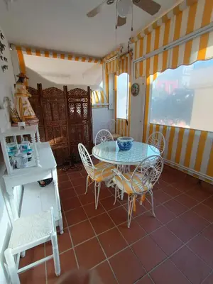 a dining room with a table and chairs at Costa Ballena - El Paraíso in Rota