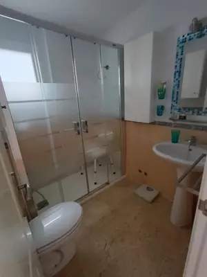 a bathroom with a shower and a toilet and a sink at Costa Ballena - El Paraíso in Rota
