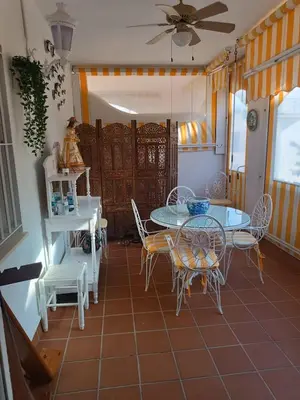 a dining room with a table and chairs at Costa Ballena - El Paraíso in Rota