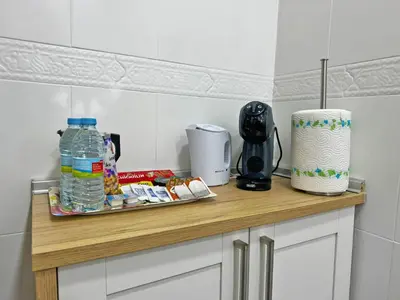 a counter with a tray of food and a bottle of water at Apartamento Acebuche - Ole Solutions in Jerez de la Frontera
