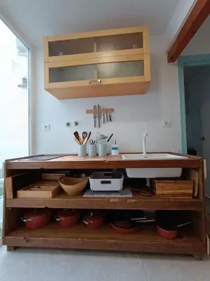 a kitchen counter with a sink in a room at LA CASA DE LAS BICIS in Cádiz