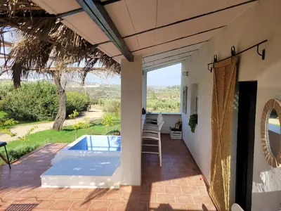 an external view of a house with a swimming pool at casa entre mer et montagne in Arcos de la Frontera