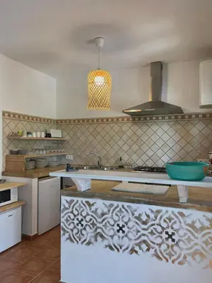 a kitchen with a sink and a stove at casa entre mer et montagne in Arcos de la Frontera