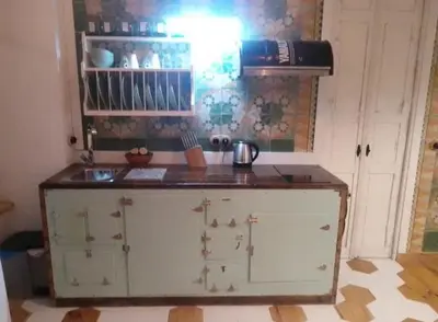 a kitchen with a sink and a counter top at La gota de leche 1 in Sanlúcar de Barrameda
