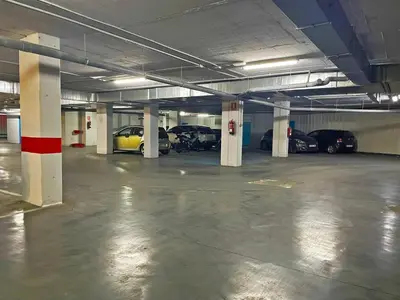 an empty parking garage with cars parked in it at Apartamento Moscatel - Ole Solutions in Jerez de la Frontera