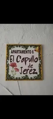 a sign on a wall with a sign on it at APARTAMENTO CAMPANA-6 in Jerez de la Frontera
