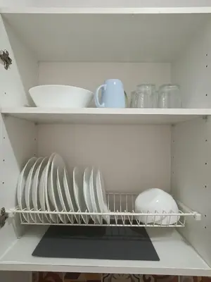a shelf with plates and bowls in a refrigerator at APARTAMENTO CAMPANA-6 in Jerez de la Frontera
