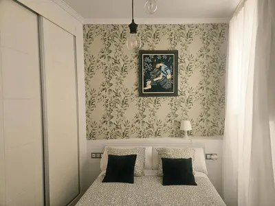 a bedroom with a bed with yellow pillows on it at Paraíso Malecón de Cádiz in Cádiz