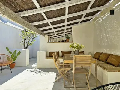 a dining room with a wooden table and chairs at Casa Leopoldo - Ole Solutions in Bornos