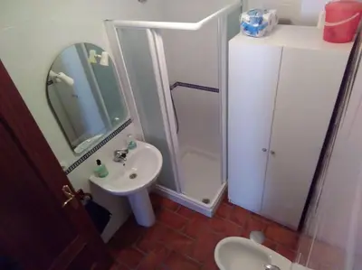 a bathroom with a shower and a sink at Piscina y garaje a 300 m de playa OJO VER CORREO NO DESEADO SI NO LLEGA RESPUESTA in Rota