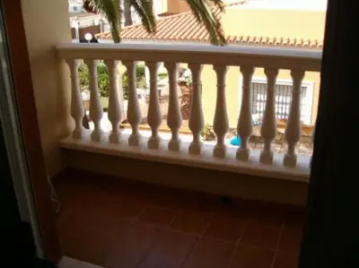 a balcony with a white railing and a window at Piscina y garaje a 300 m de playa OJO VER CORREO NO DESEADO SI NO LLEGA RESPUESTA in Rota