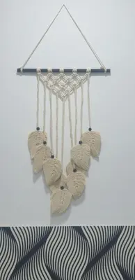 a rack with three pairs of shoes hanging from a wall at APARTAMENTO BRIANNA in Jerez de la Frontera