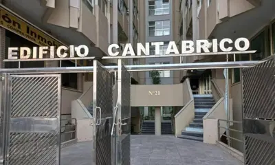 a sign for the entrance to a building at Apartamento Playa Victoria I in Cádiz