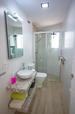 a bathroom with a sink and a toilet and a shower at Chiclana.Balconera.1ªlínea playa in Chiclana de la Frontera