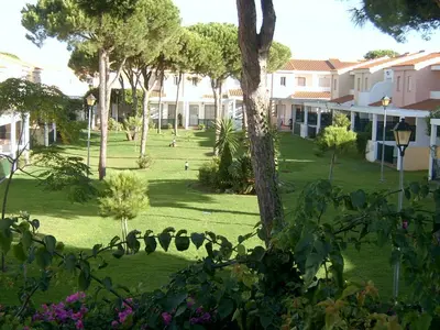a view of a park with trees and buildings at Chiclana.Balconera.1ªlínea playa in Chiclana de la Frontera