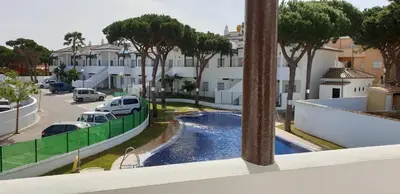 a living room with a couch and a table at Chiclana Costa in Chiclana de la Frontera