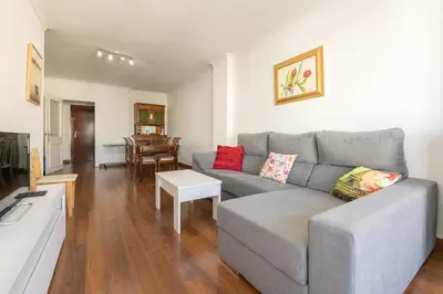 a living room with a couch and a table at El Trebol in El Puerto de Santa María