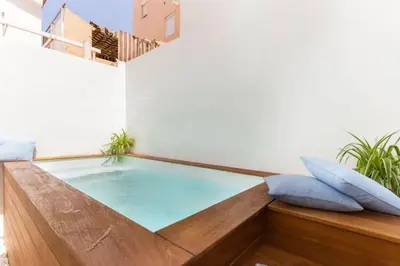 a hot tub in the middle of a room at Apartamento planta baja con piscina privada a 50 m de la playa in Sanlúcar de Barrameda