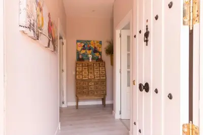 a hallway with a dresser in a room at Apartamento planta baja con piscina privada a 50 m de la playa in Sanlúcar de Barrameda