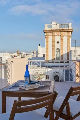 a swimming pool on the roof of a building at VG - Villa de Andas suites in Cádiz