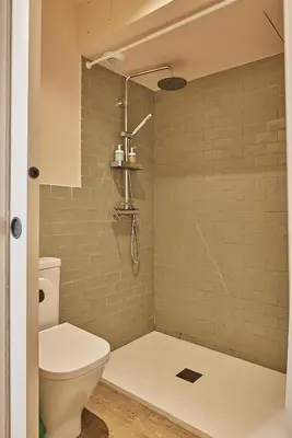 a bathroom with a toilet and a shower at VG - Villa de Andas suites in Cádiz
