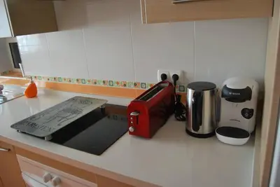 a kitchen counter with a toaster and other appliances on it at Apartamento cerca del centro in Jerez de la Frontera