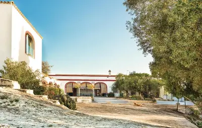 a large building with a driveway in front of it at Viña Santa Petronila Torre in Jerez de la Frontera