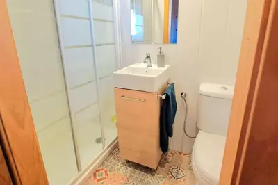 a bathroom with a shower and a sink and a toilet at Alojamiento Mise in Conil de la Frontera