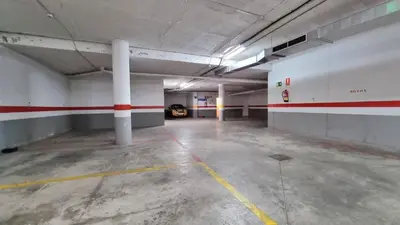 an empty parking garage with a car parked in it at Apartamento Centro con Parking Privado in El Puerto de Santa María