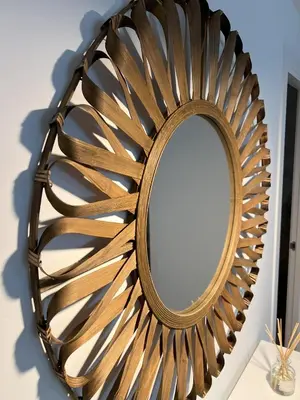 a mirror with a wooden frame on a wall at Jardines del Porvenir 4 in Puerto Real