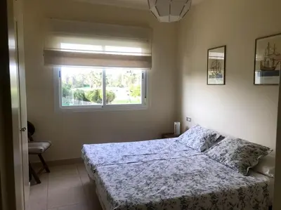 a bedroom with a bed and a window at Vacaciones de lujo GOLF-PLAYA. Costa Ballena-Cádiz in Rota