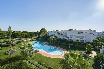 an aerial view of a resort with a swimming pool at Acogedora vivienda Costa Ballena in Chipiona