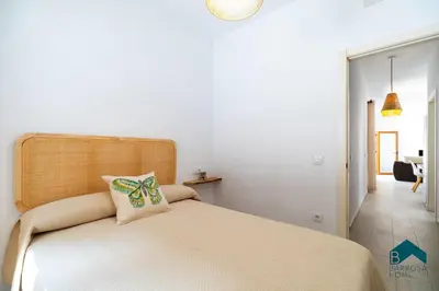 a bedroom with a bed with a pillow on it at VILLA SUR in Chiclana de la Frontera
