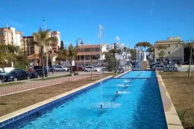 a large swimming pool with ducks in a city at Piso céntrico y tranquilo con garaje incluido in Sanlúcar de Barrameda