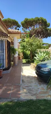 a car parked in front of a house at Beach house near Tennis Club La Barrosa in Chiclana de la Frontera