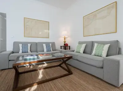 a living room with a couch and a coffee table at Apartoyou - Río Guadalete in El Puerto de Santa María