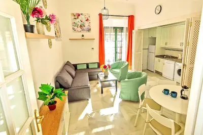 a living room with a couch and a table at Central & Style - Bars and Restaurants all around Apartment in El Puerto de Santa María